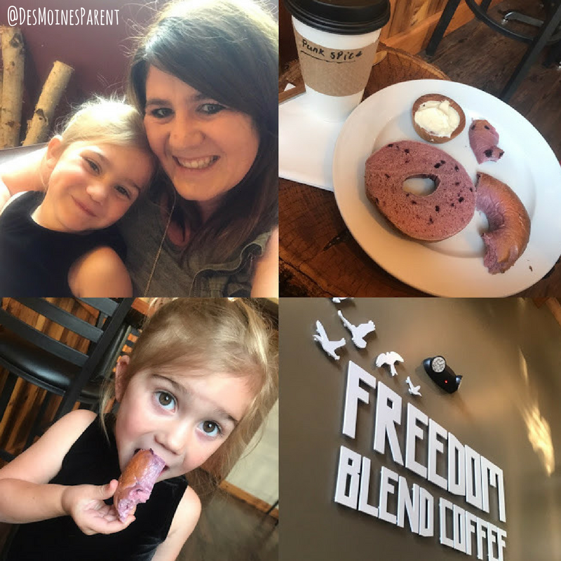 Mother and daughter with bagels and coffee at Freedom Blend Coffee.